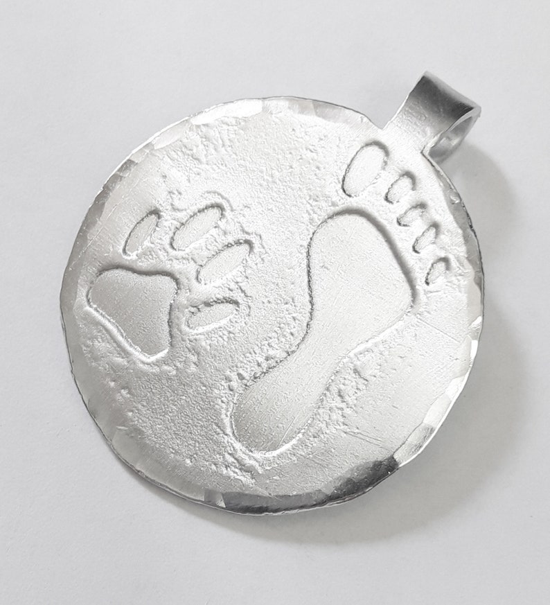 Aluminum pendant medal with a dog paw print and human footprint, with personalized text on the back. image 2