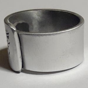 Open aluminum band ring with: He follows her, and custom text. image 3