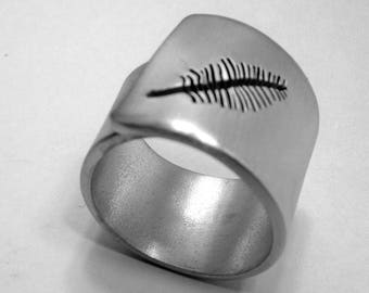 Personalized text, open aluminum band ring with a perforated feather.