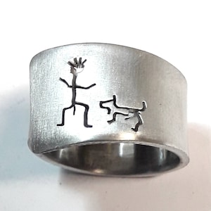 Personalized text. Open aluminum band ring with He and his dog.