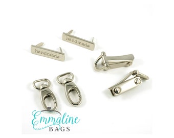 May include: Two silver metal clasps, two silver metal swivel hooks, and two silver metal tags that say "handmade".