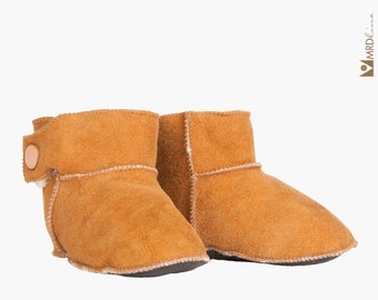 Handmade tobacco ankle boots fur slippers for babies. Genuine sheepskin. Soft, warm and comfortable