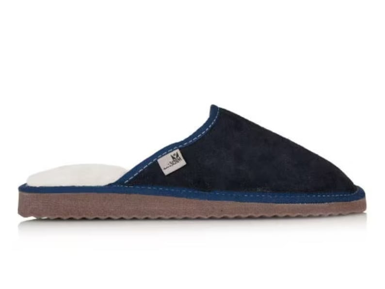 May include: Navy blue suede slippers with a white fleece lining and a brown rubber sole.