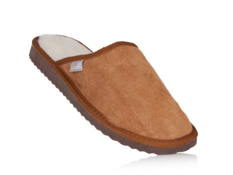 May include: Brown suede slippers with a white fleece lining. The slippers have a brown rubber sole.