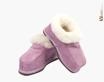 Handmade lilac fur slippers for child. Suede leather, sheepskin and wool. Soft, warm and comfortable.