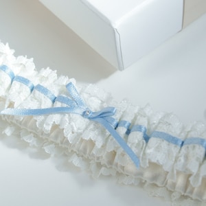 Handcrafted Ivory Lace Bridal Garter: Satin, Blue Ribbon Detail