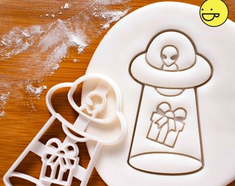 UFO Christmas Present Abduction cookie cutter | Bakerlogy cutters Grey Alien spaceship Santa Claus party extraterrestrial paranormal abduct