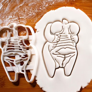 Cortador de galletas Venus de Höhle Fels: diosa paleolítica, figura femenina, artefacto antiguo, escultura arqueológica