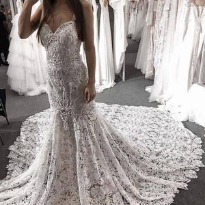 May include: A rustic wooden sign with the text "Welcome to our home" in white lettering. The sign features a distressed finish and a simple, inviting design, perfect for front door decor.