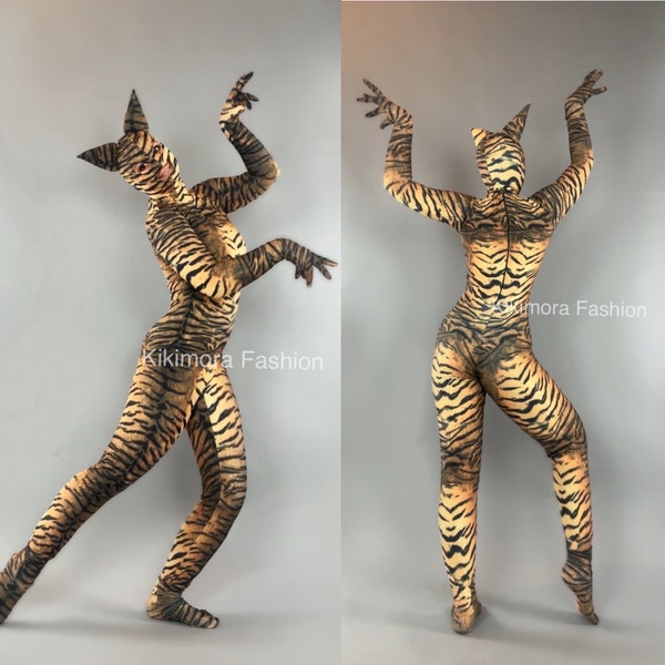 Disfraz de mujer gata, disfraz de tigre, disfraz de Halloween, tendencia actual, moda festiva. Ropa de baile exótica.
