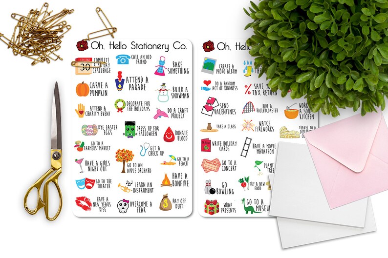 May include: Two white cards with black text and colorful illustrations. The cards list 30 things to do throughout the year, such as "Attend a Parade", "Carve a Pumpkin", "Go to a Concert", and "Plant a Tree".