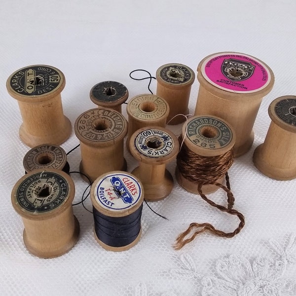 Lot of 12 vintage wooden spools in interesting sizes, rare shapes with manufacturing info carved into the wood or old elaborate label, NO.4