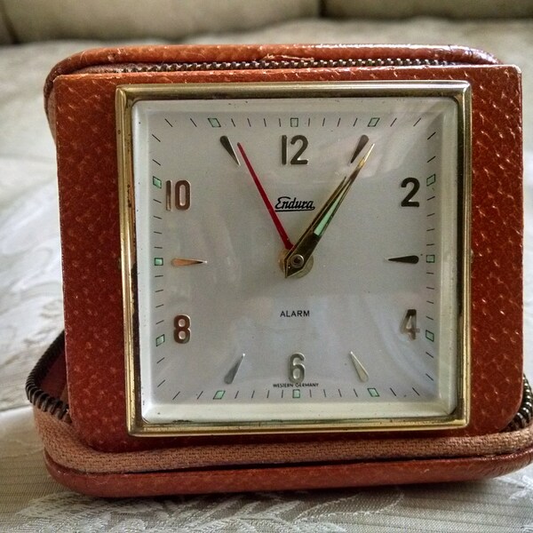 Endura folding vintage travel alarm clock, leather zippered case, Western Germany, labeled B F Goodrich monthly winner, works great!