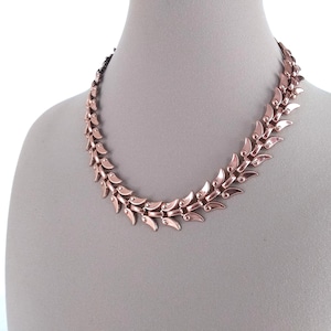 May include: A rustic wooden sign with the text "Welcome to our home" in white lettering. The sign features a distressed finish and a simple, inviting design, perfect for a front porch or entryway.