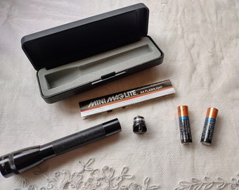 Vintage Mini Maglite AA Flashlight with batteries ©1990 Mag Instrument, Inc., in original "attractive black presentation gift packaging"