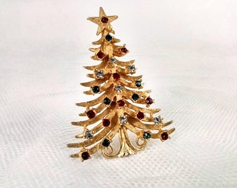 Vintage MYLÚ Christmas tree pin or brooch features a gold tree with colored rhinestones as the ornaments in red, green and clear, signed