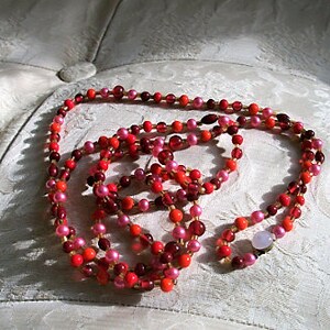 Long beaded necklace, opaque reds, pinks, rose and browns, stunning, 1940's image 2