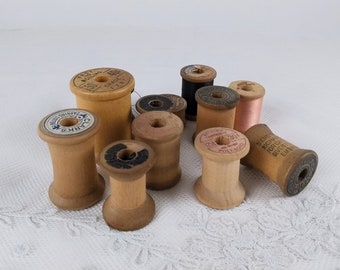 Lot of 12 vintage wooden spools in interesting sizes, rare shapes with manufacturing info carved into the wood or old elaborate label, NO. 1