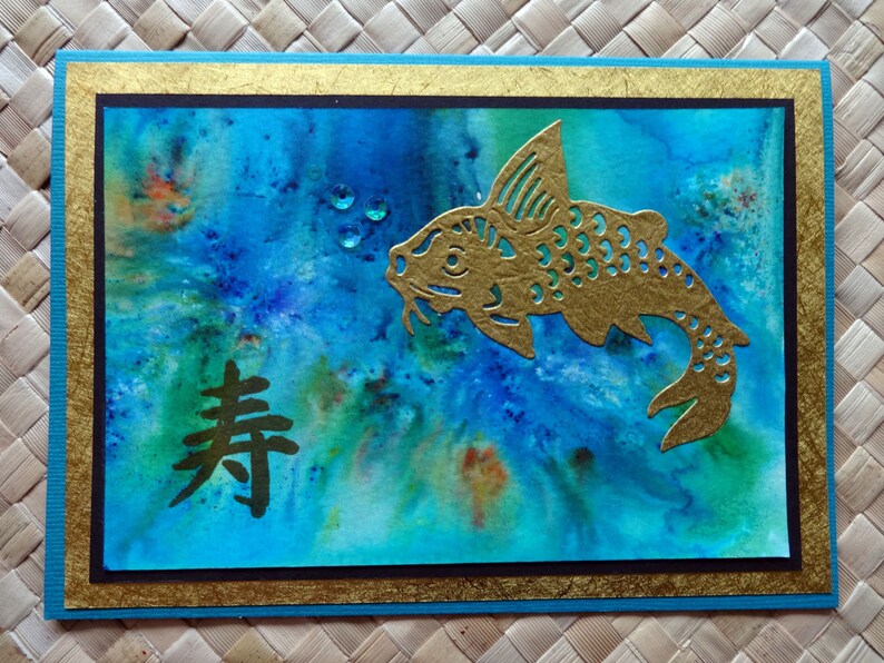 Oriental birthday card with koi and kotobuki longevity symbol