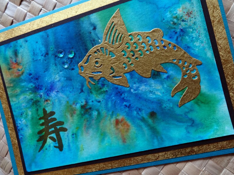 Oriental birthday card with koi and kotobuki longevity symbol