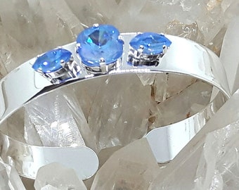 Open bangle bracelet, rigid, silver plated, adorned with 3 Austrian crystal cabochons, Blue Ice