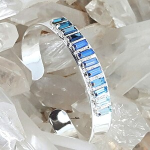 Open bangle bracelet, rigid, silver plated, adorned with 3 Swarovski crystal cabochons, Frost