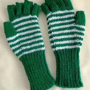 May include: A pair of green and white striped fingerless gloves. The gloves are knitted and have a white stripe pattern.