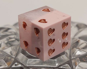 Pink terracotta colored D6 dice