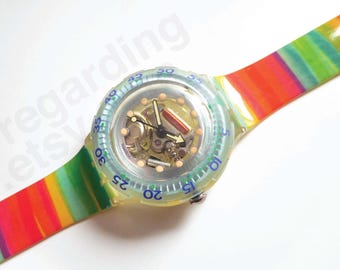 1990s 1991 Swatch watch Scuba SDK104 38mm, skeleton Jelly Bubbles design, rainbow stripes strap, good unworn condition, no box