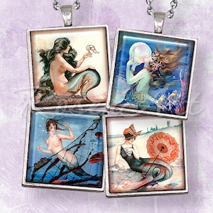 May include: Four square glass pendants with silver frames, each featuring a vintage illustration of a mermaid. One mermaid holds a seashell, another holds a shoe, one is in a net, and the last is on a beach with an umbrella.