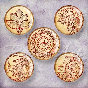 May include: Five round, decorative, glass cabochons with red and white mandala designs. The designs include a lotus flower, an eye with a triangle above it, and three different mandala patterns.