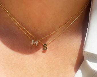 Pair of 14k gold initial necklaces