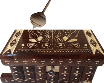 Handmade brown wooden jewelry box case surprise magic secret puzzle box hidden key and spinning top hand turned from natural hazelnut wood