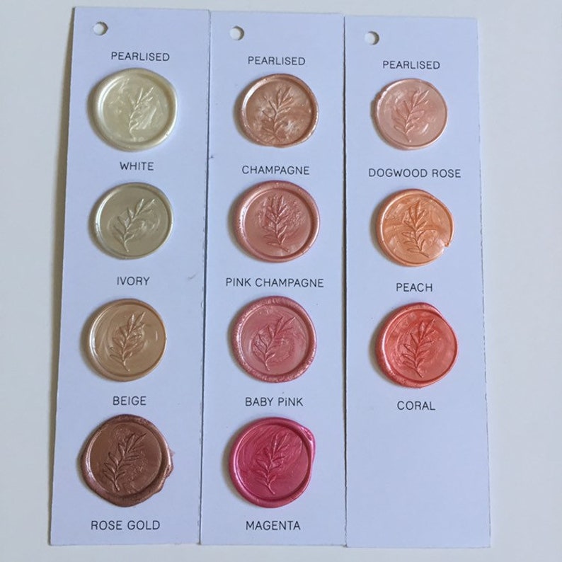 May include: A sample card showing 12 different colors of wax seals with a leaf design. The colors are: White, Ivory, Beige, Rose Gold, Champagne, Pink Champagne, Baby Pink, Magenta, Dogwood Rose, Peach, Coral.