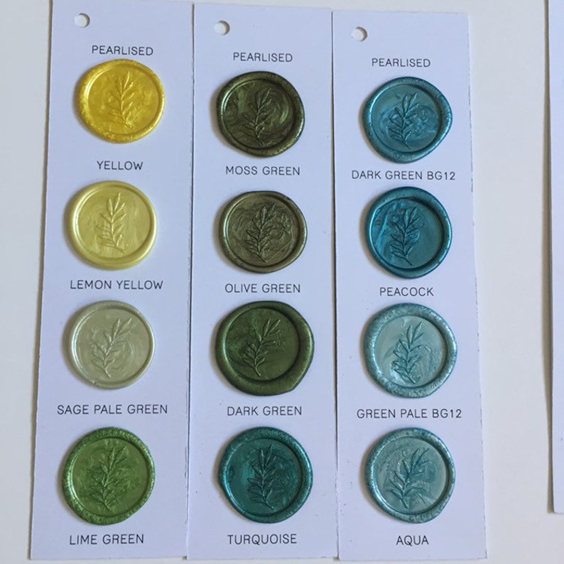 May include: A sample card with 12 wax seal colors, including yellow, green, and blue. The card shows the wax seal colors in both pearlized and non-pearlized finishes. The card also includes the names of each color.