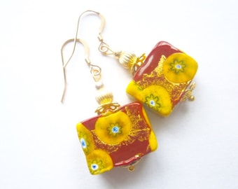 Murano glass earrings with red and gold oblong Murano glass beads with gold filled wires.