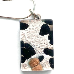 Murano glass pendant with silver and black Murano glass rectangle with sterling silver chain.