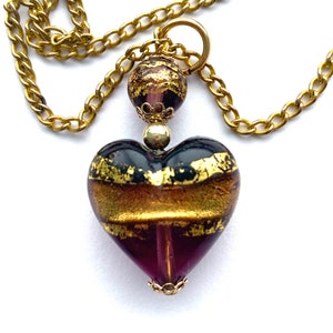 Murano glass pendant with purple and gold Murano glass heart and gold chain.