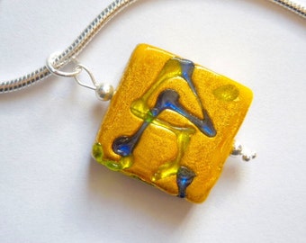 Murano glass pendant with yellow mustard spangle bead and sterling silver chain.