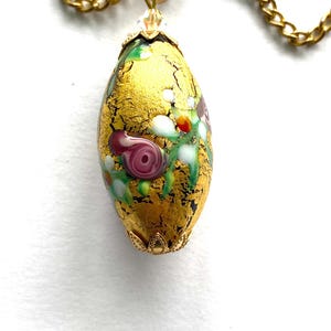 Murano glass pendant with gold decorated Murano bead with gold chain.