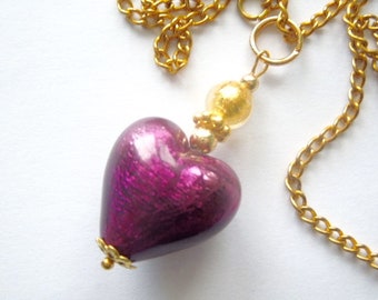 Murano glass pendant with purple Murano glass heart and gold chain.