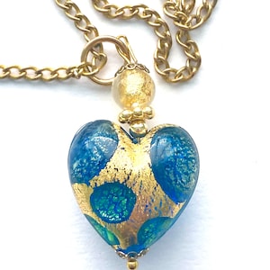 Murano glass pendant with blue and gold Murano glass heart and gold chain.