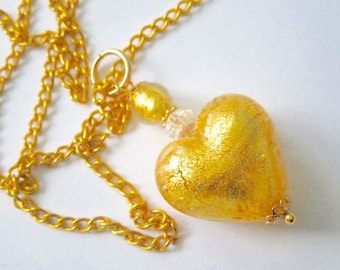 Murano glass pendant with gold Murano glass heart bead Swarovski crystal and gold chain.