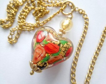 Murano glass pendant with red and gold Murano heart bead and gold chain.