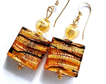 Murano glass earrings with gold and black Murano glass square beads and gold filled earwigs.