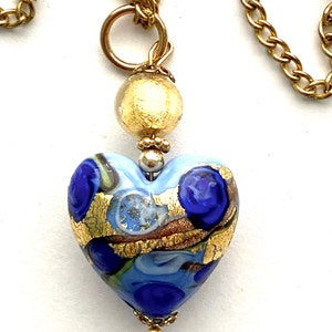 Murano glass pendant with blue and gold Murano heart bead and gold chain.