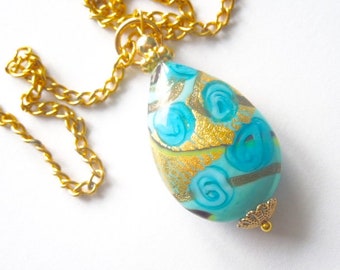 Murano glass pendant with turquoise blue and gold Murano glass teardrop and gold chain.