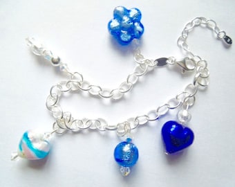 Sterling silver charm bracelet with blue and silver Murano Glass beads and Swarovski crystal.