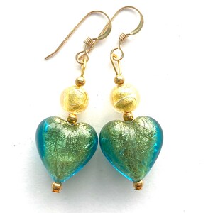 Murano Glass earrings with green and gold Murano Glass beads and gold fill wires.