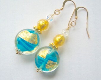 Murano glass earrings with gold and aquamarine Murano lentil beads with gold filled wires.